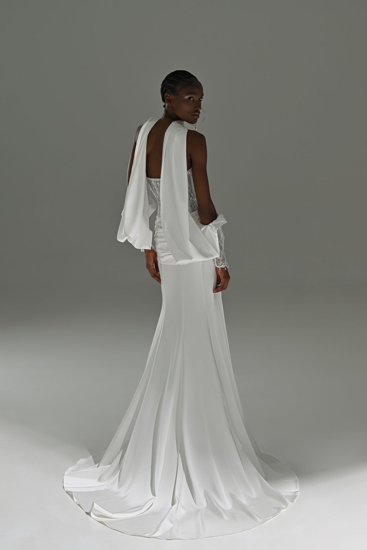 Satin sheath wedding dress with lace corset – back view with the satin train