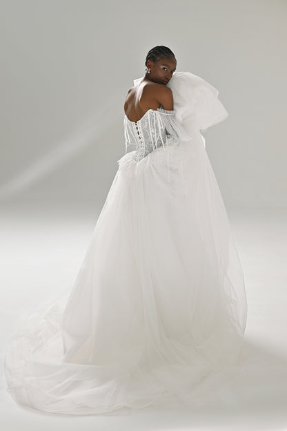 Lace and tulle ball gown wedding dress with puff sleeves – back three-quarter view of the tulle skirt