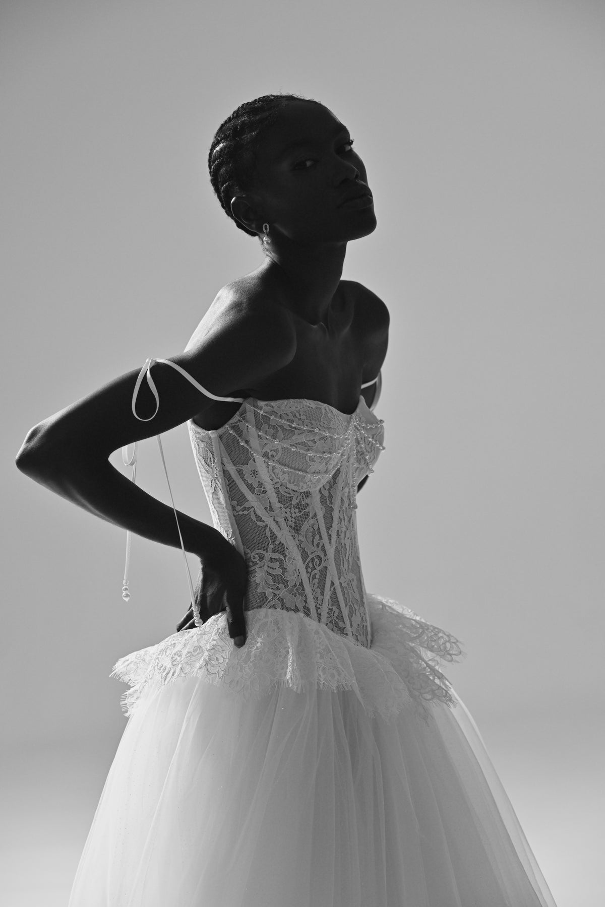 Lace and tulle ball gown wedding dress – black and white close-up of the corset bodice and peplum