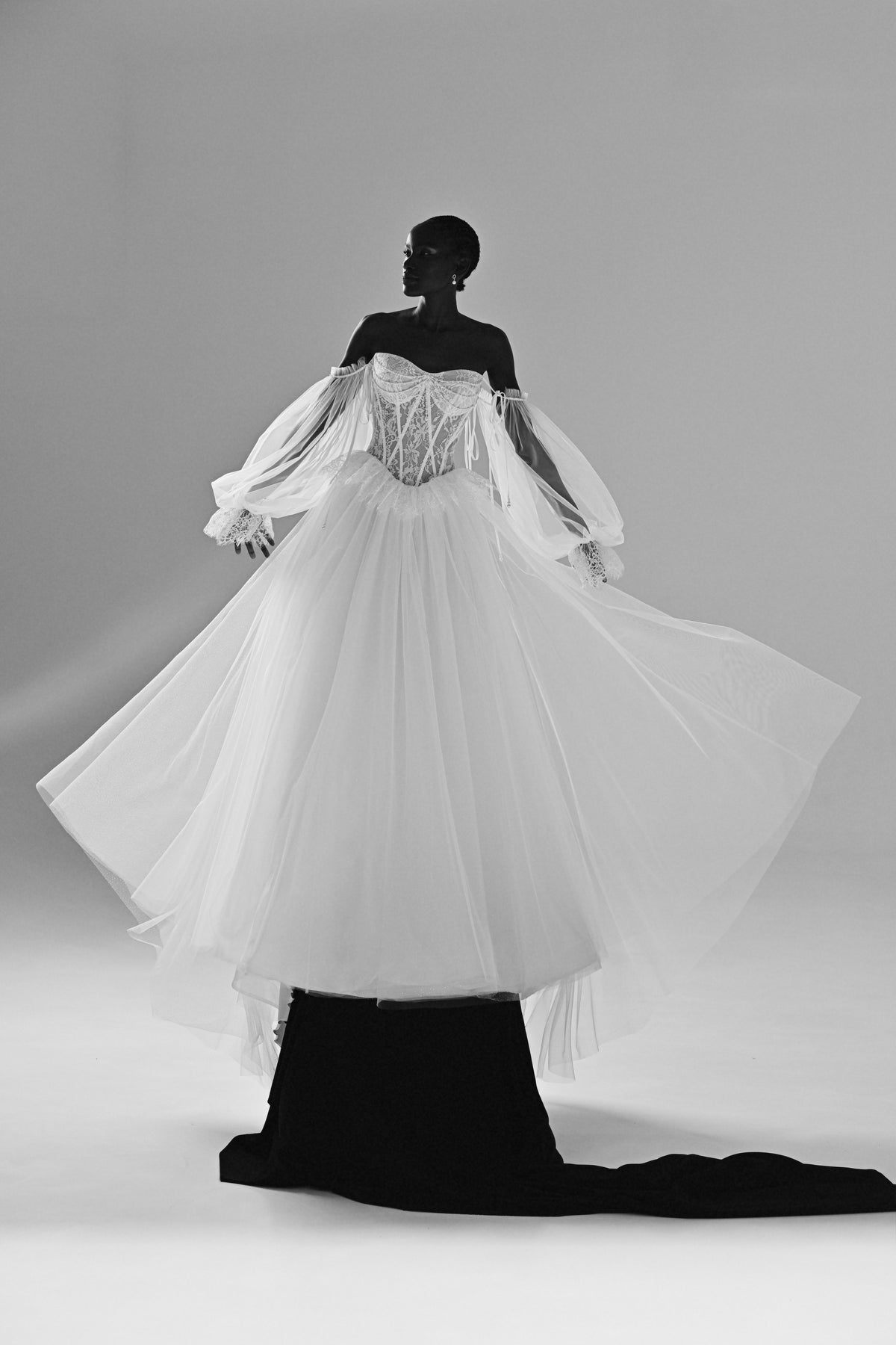Lace and tulle ball gown wedding dress – back view with the flared tulle overskirt and sheer sleeves