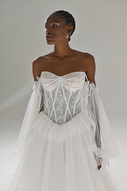 Lace and tulle ball gown wedding dress – close-up of the off-shoulder corset and sheer puff sleeves