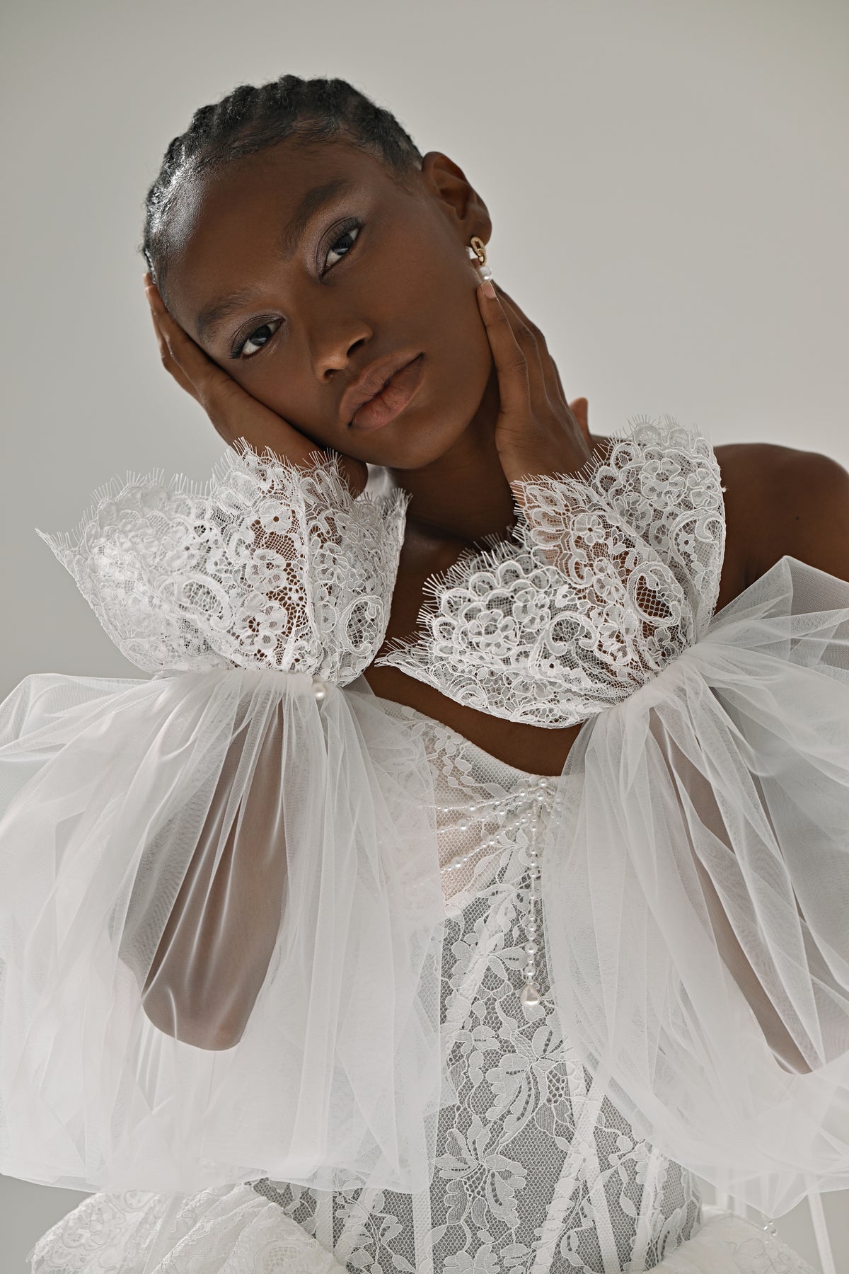 Lace and tulle ball gown wedding dress – close-up of the lace corset and ruffled sheer sleeves