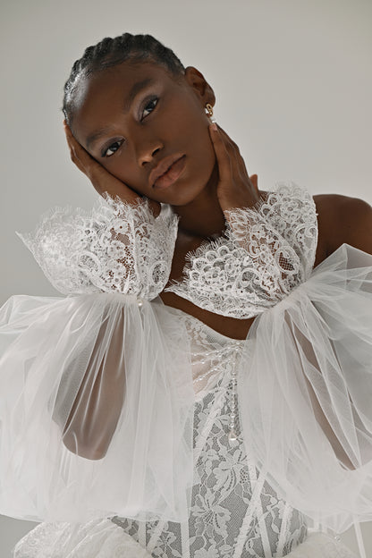Lace and tulle ball gown wedding dress – close-up of the lace corset and ruffled sheer sleeves