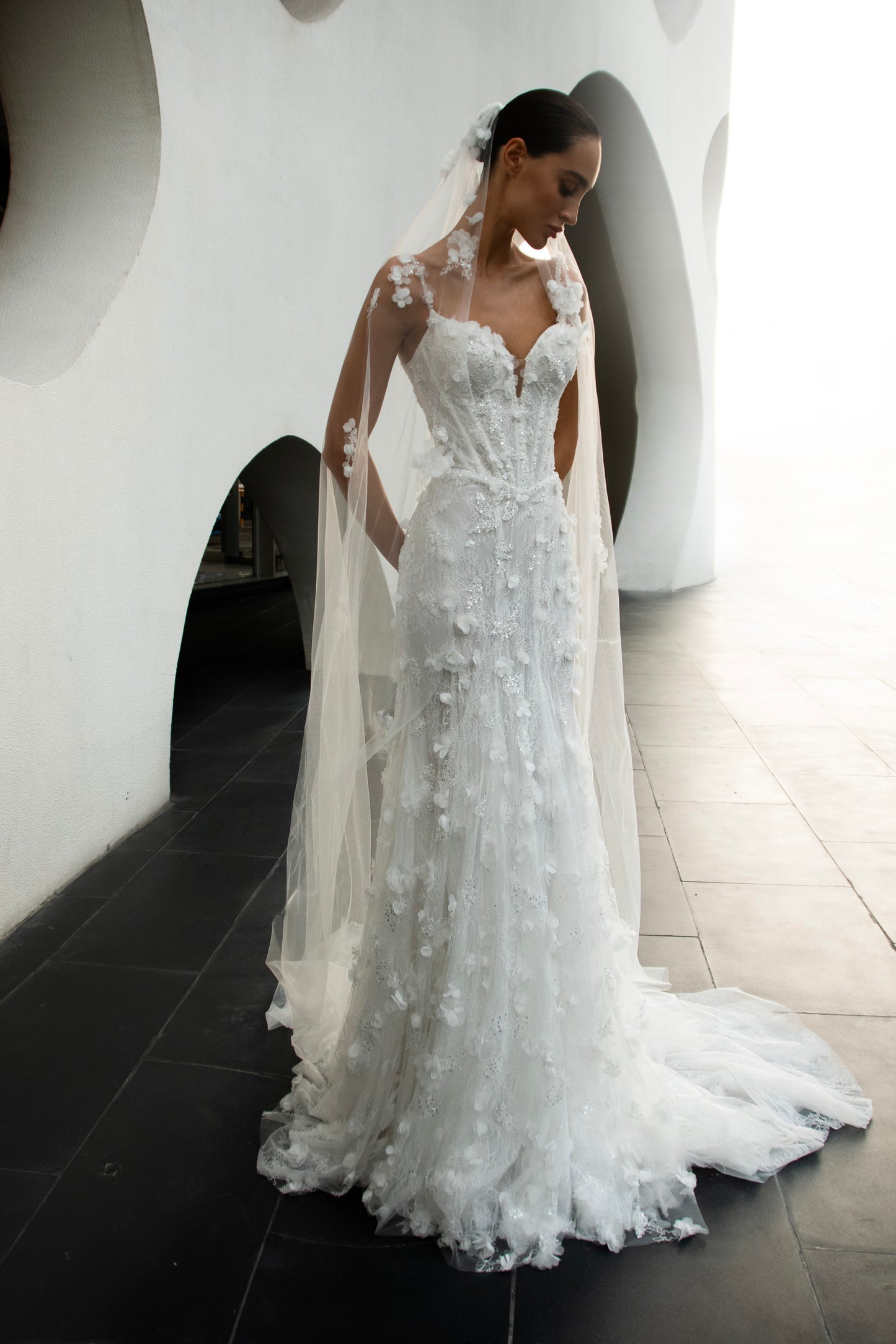 Bride wearing the Capri lace and tulle mermaid wedding gown from the Celeste Collection.