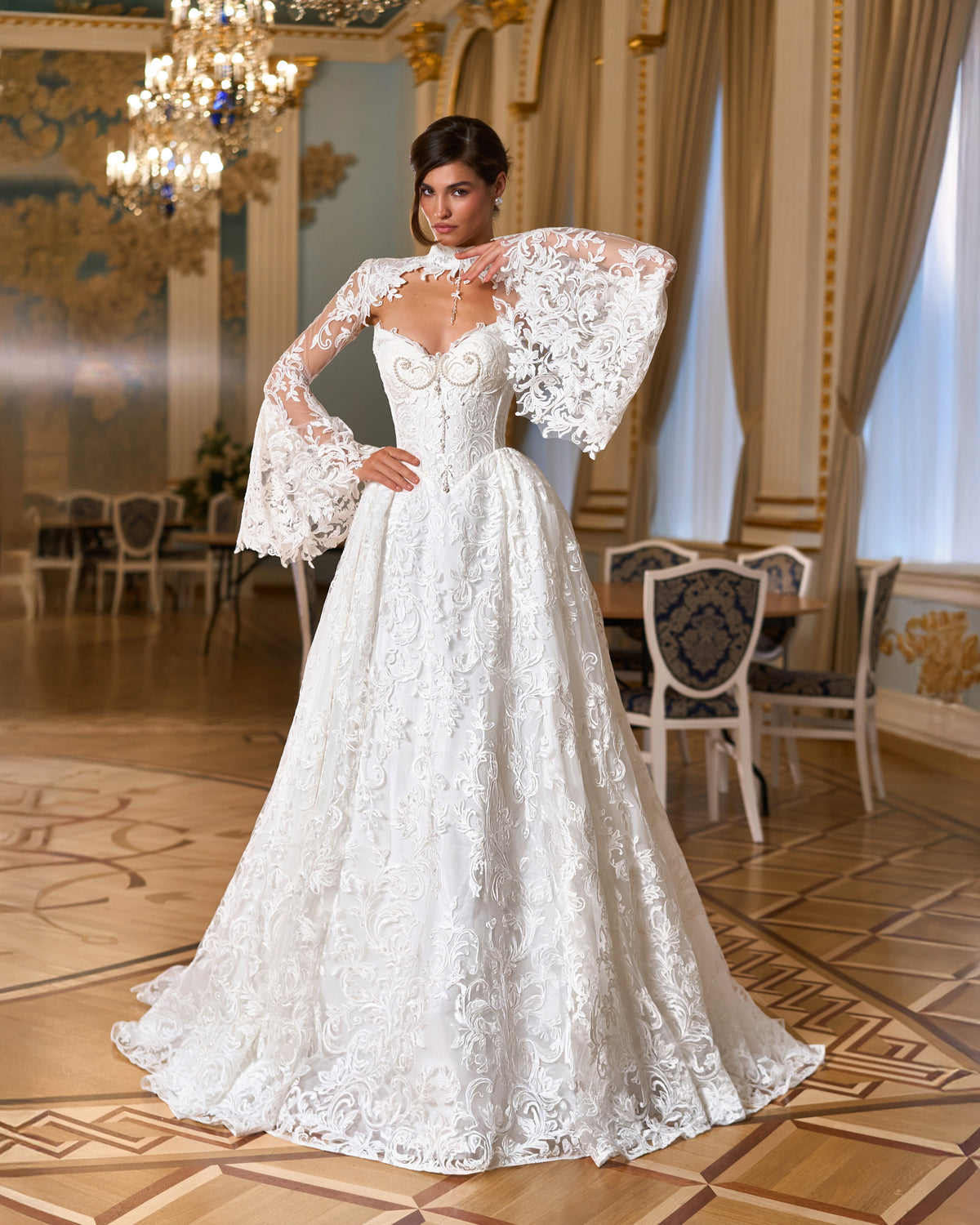 A-line lace wedding dress with sweetheart corset bodice and lace bolero with wide bell sleeves