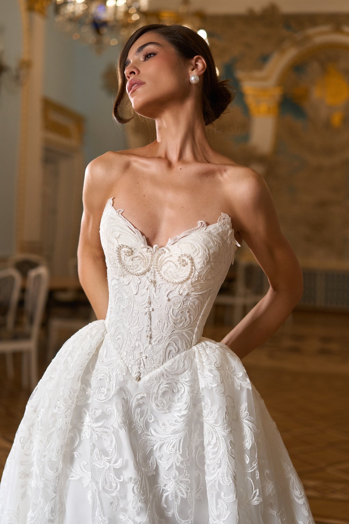 Strapless sweetheart corset bodice with pearl beading and lace appliqué ball gown skirt