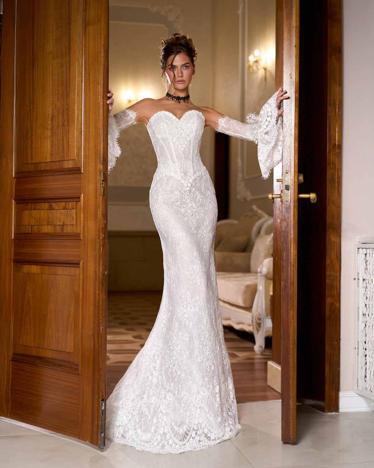 Mermaid lace wedding dress with sweetheart corset bodice and long lace sleeves with bell cuffs