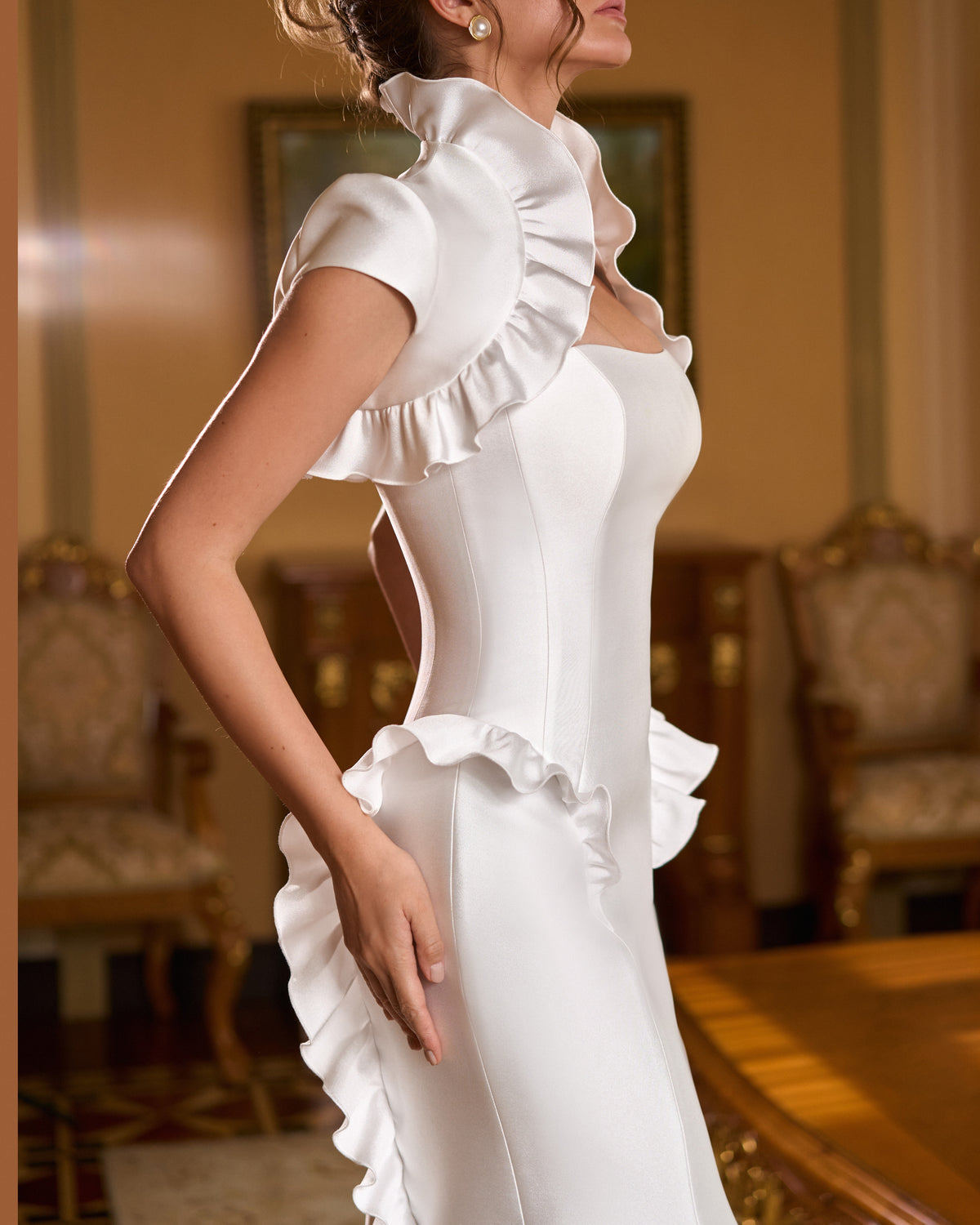 Side view of mermaid wedding dress with ruffle collar bolero, cap sleeve and cascading back ruffle