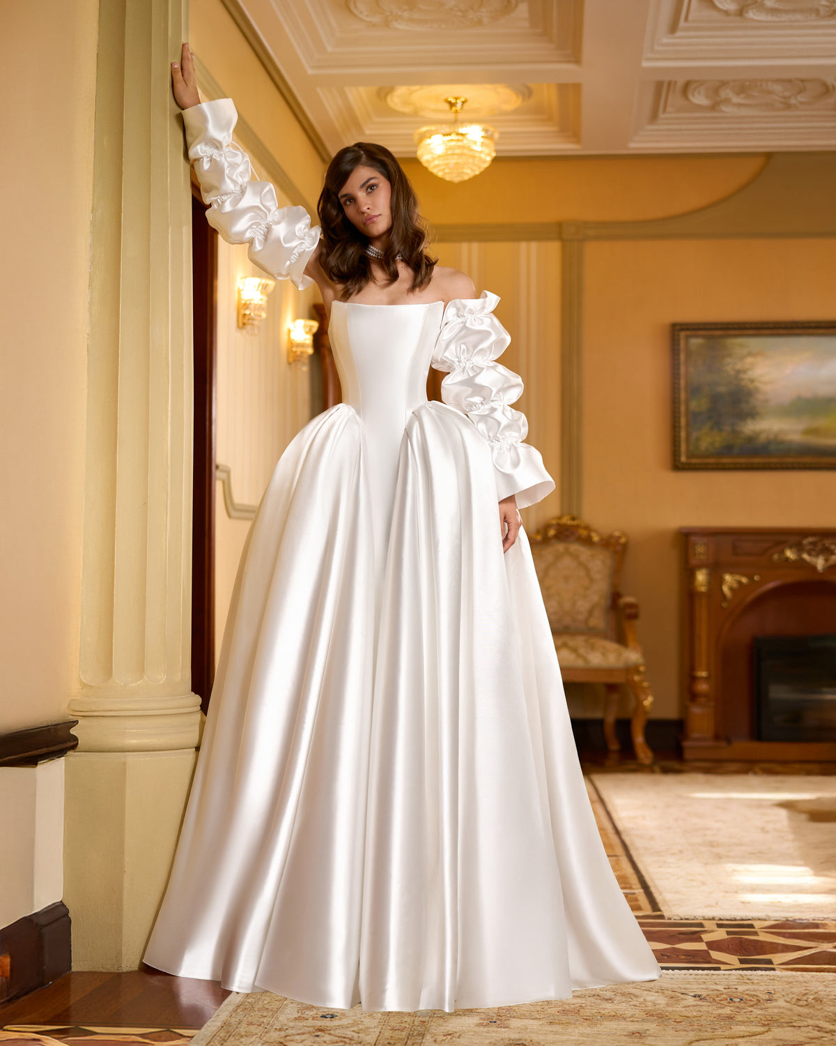 Ball gown wedding dress with corset bodice, full skirt and detachable gathered long sleeves