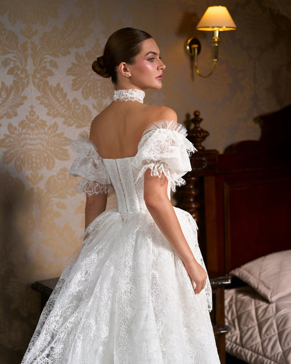 Back view of corset bodice with buttoned closure, lace puff sleeves and lace choker