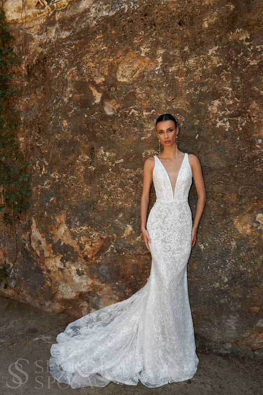 Bride in mermaid sequin embroidered lace wedding gown with deep-V neckline, open keyhole back, and sweep train.