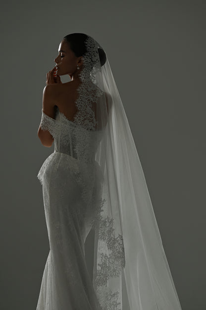 Lace mermaid wedding dress with off-shoulder corset – side view with the long veil