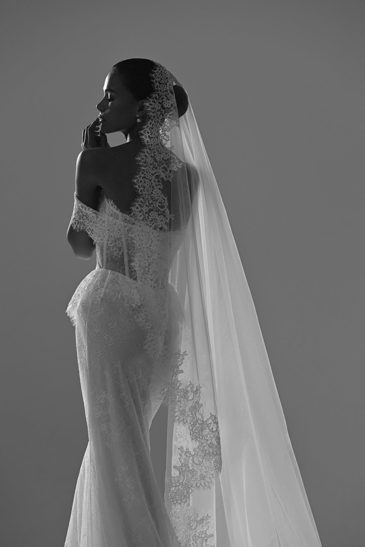 Lace mermaid wedding dress – black and white back view of the lace and veil