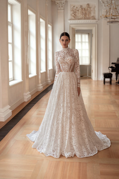 Princess wedding dress with chapel train and long sleeves.