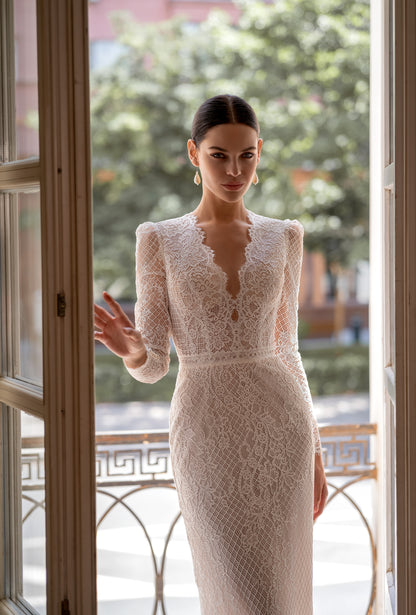 Mermaid wedding dress with lace, long sleeves, and open back