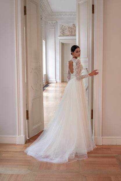 Mermaid wedding dress with lace, long sleeves, and open back