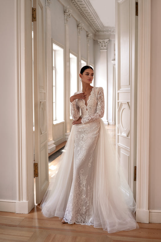 Classic mermaid wedding dress with long lace sleeves and detachable tulle train.