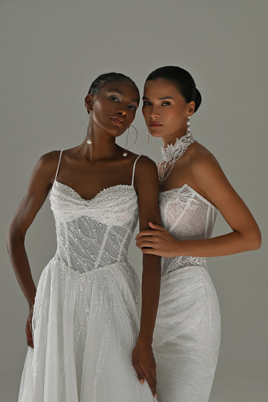 Tulle A-line wedding dress with lace corset, sweetheart neckline and spaghetti straps – two brides close together