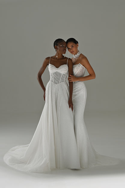 Tulle A-line wedding dress with lace corset and spaghetti straps – two brides standing, full-length view