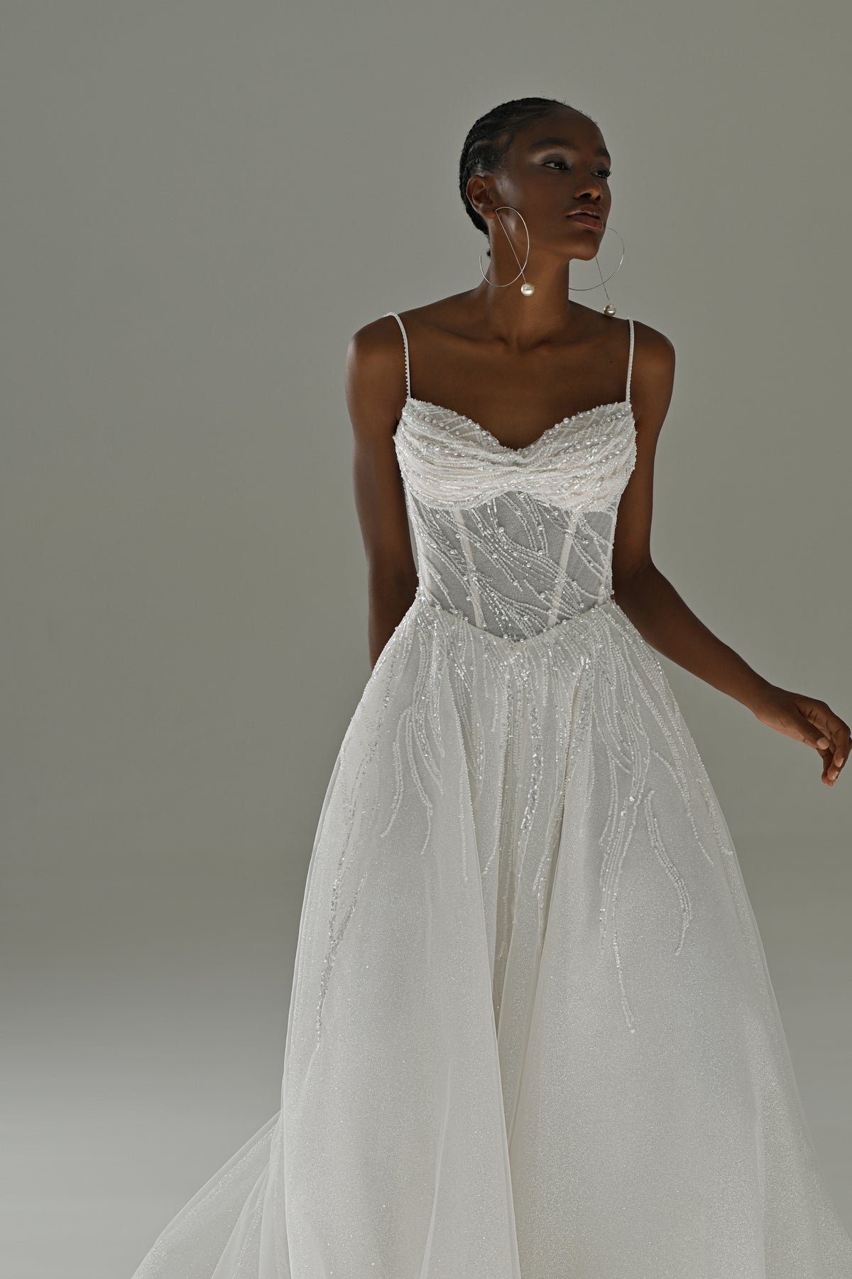 Tulle A-line wedding dress with lace corset and spaghetti straps – three-quarter front view