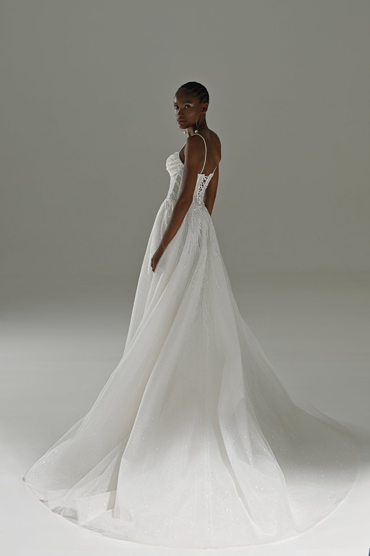 Tulle A-line wedding dress – back three-quarter view with the flowing tulle train