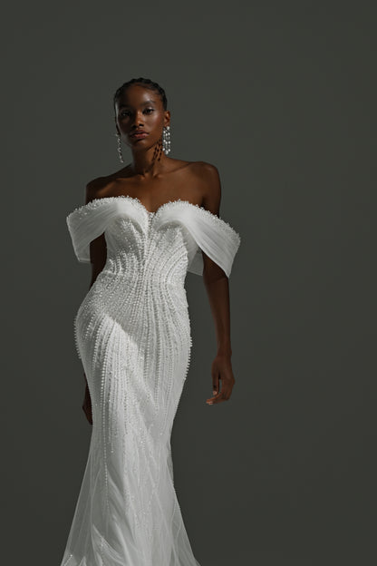 Lace mermaid wedding dress with off-shoulder draped neckline – three-quarter front view of the lace bodice