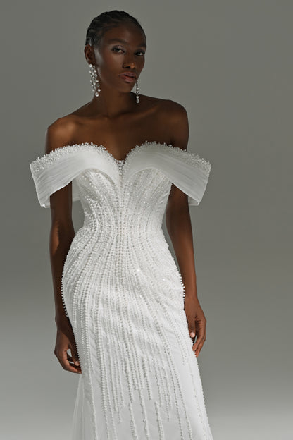 Lace mermaid wedding dress – close-up of the off-shoulder draped neckline and lace bodice