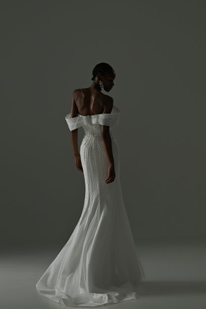 Lace mermaid wedding dress with off-shoulder neckline – back three-quarter view with the train