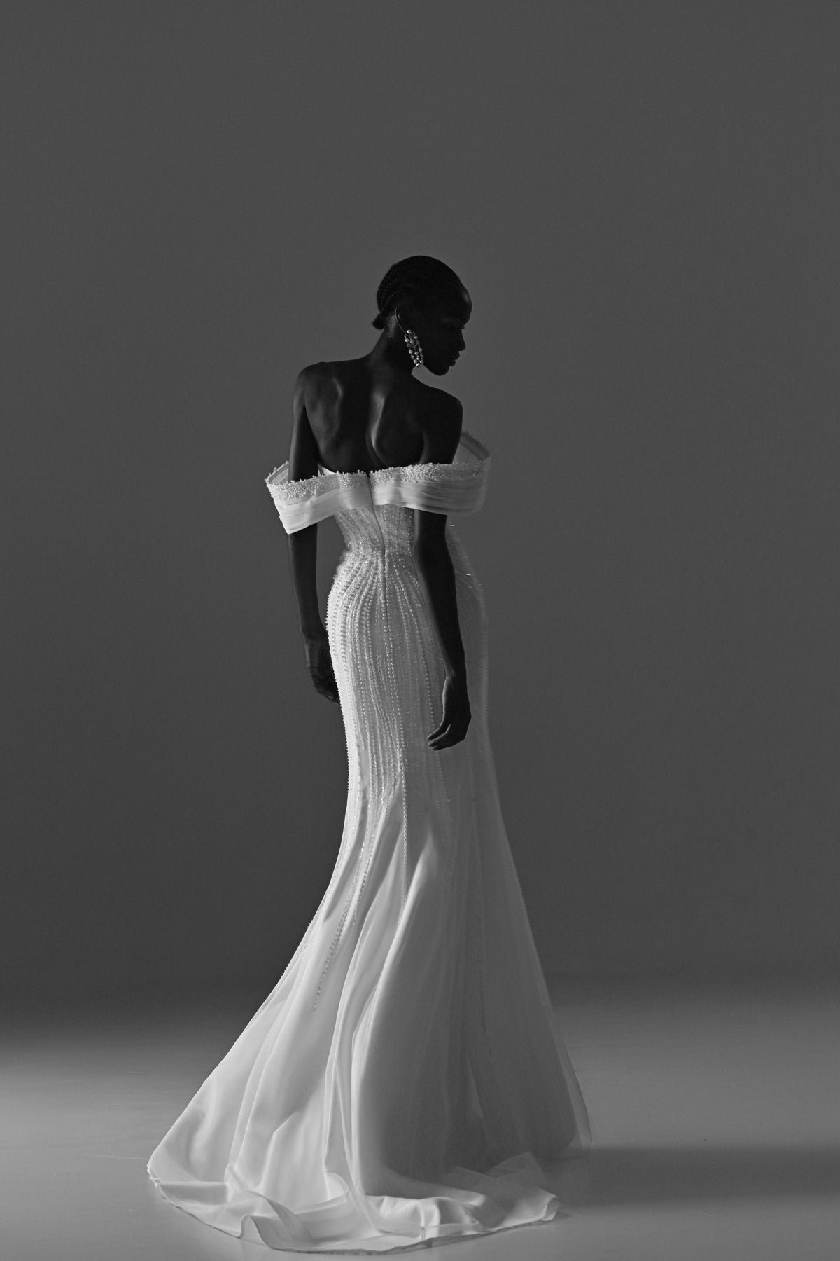 Lace mermaid wedding dress – black and white back three-quarter view