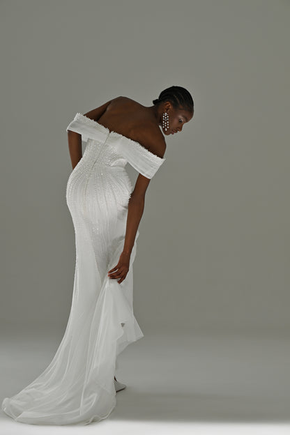 Lace mermaid wedding dress with off-shoulder draped neckline – side view leaning forward