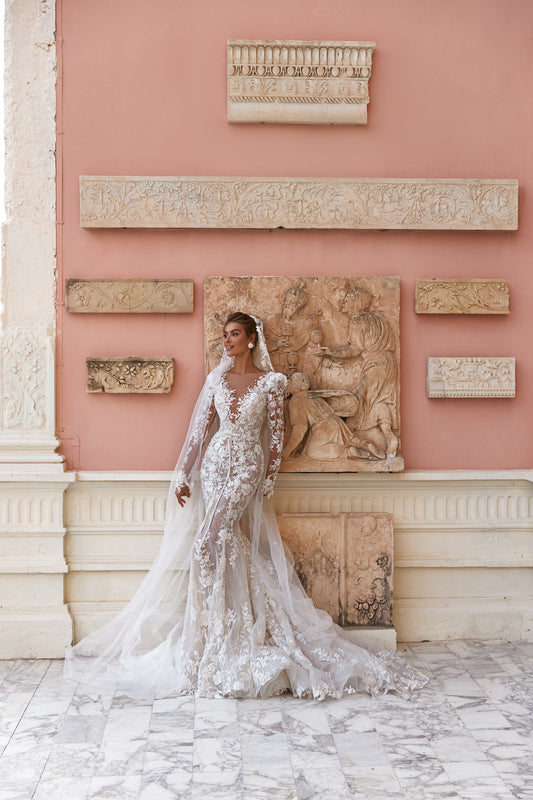 Fitted long sleeve lace wedding dress with fishtail train