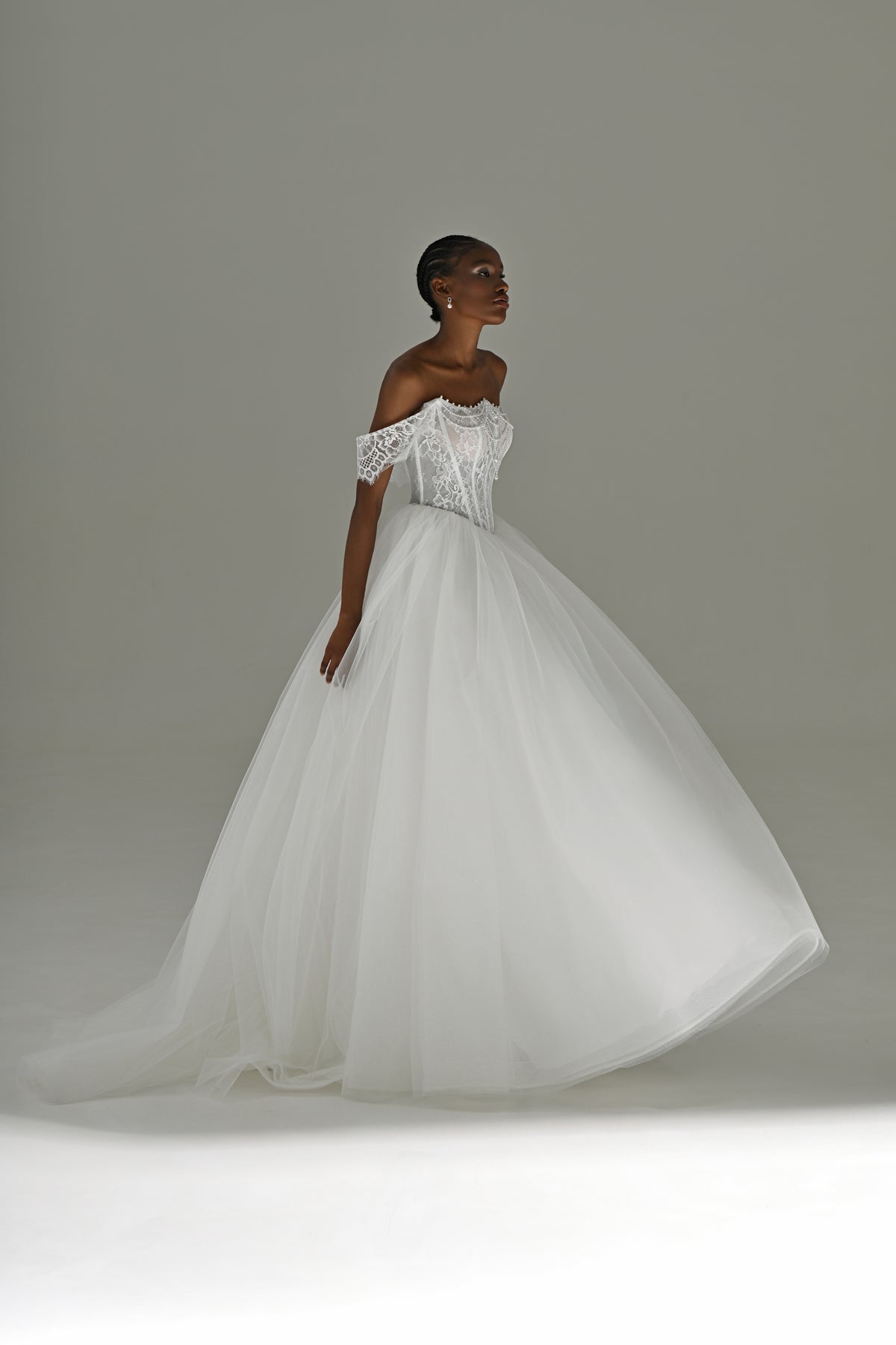 Tulle ball gown wedding dress with full skirt – three-quarter view in motion