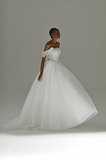 Tulle ball gown wedding dress with full skirt – three-quarter view in motion