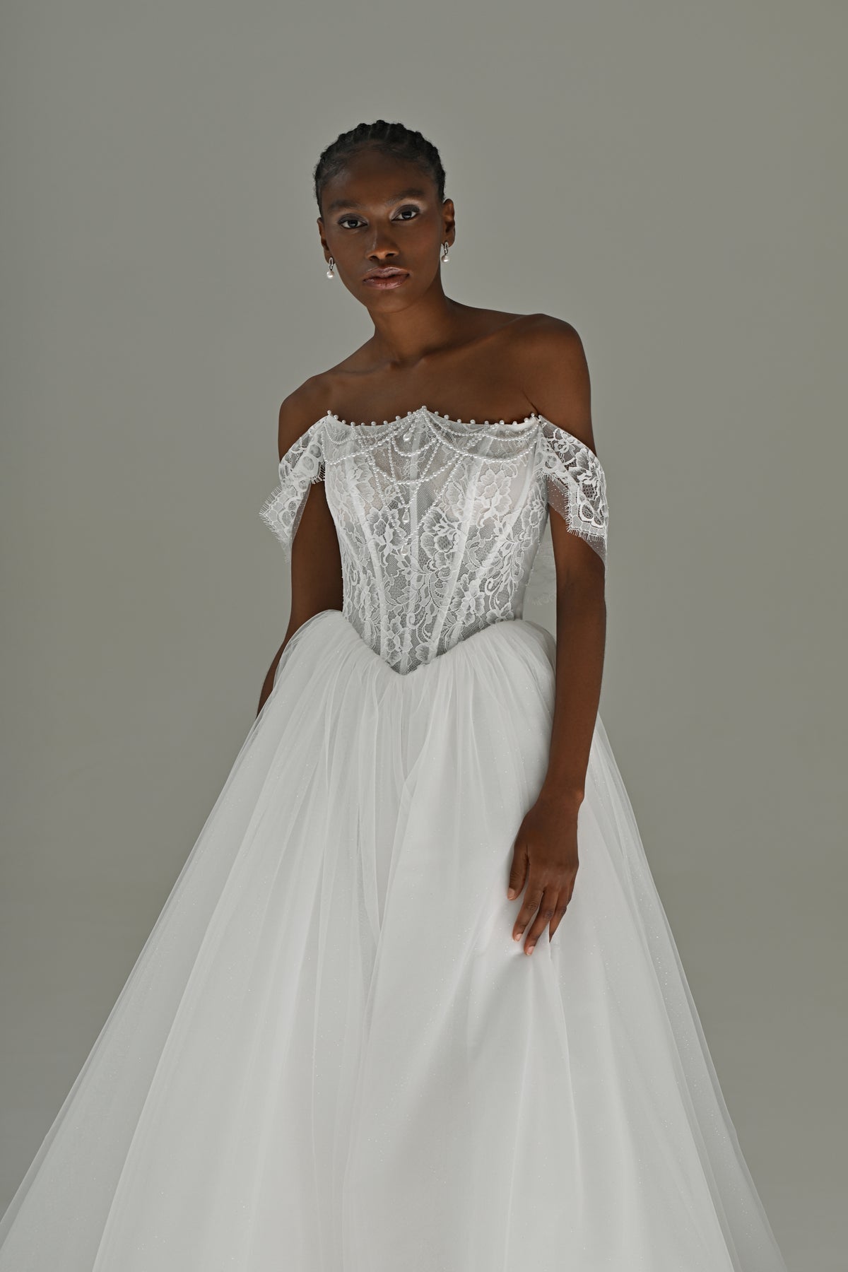 Tulle ball gown wedding dress with off-shoulder lace corset – front three-quarter view of the bodice