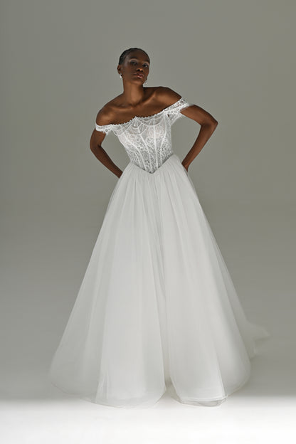Tulle ball gown wedding dress with off-shoulder lace corset – full-length front view, hands on hips