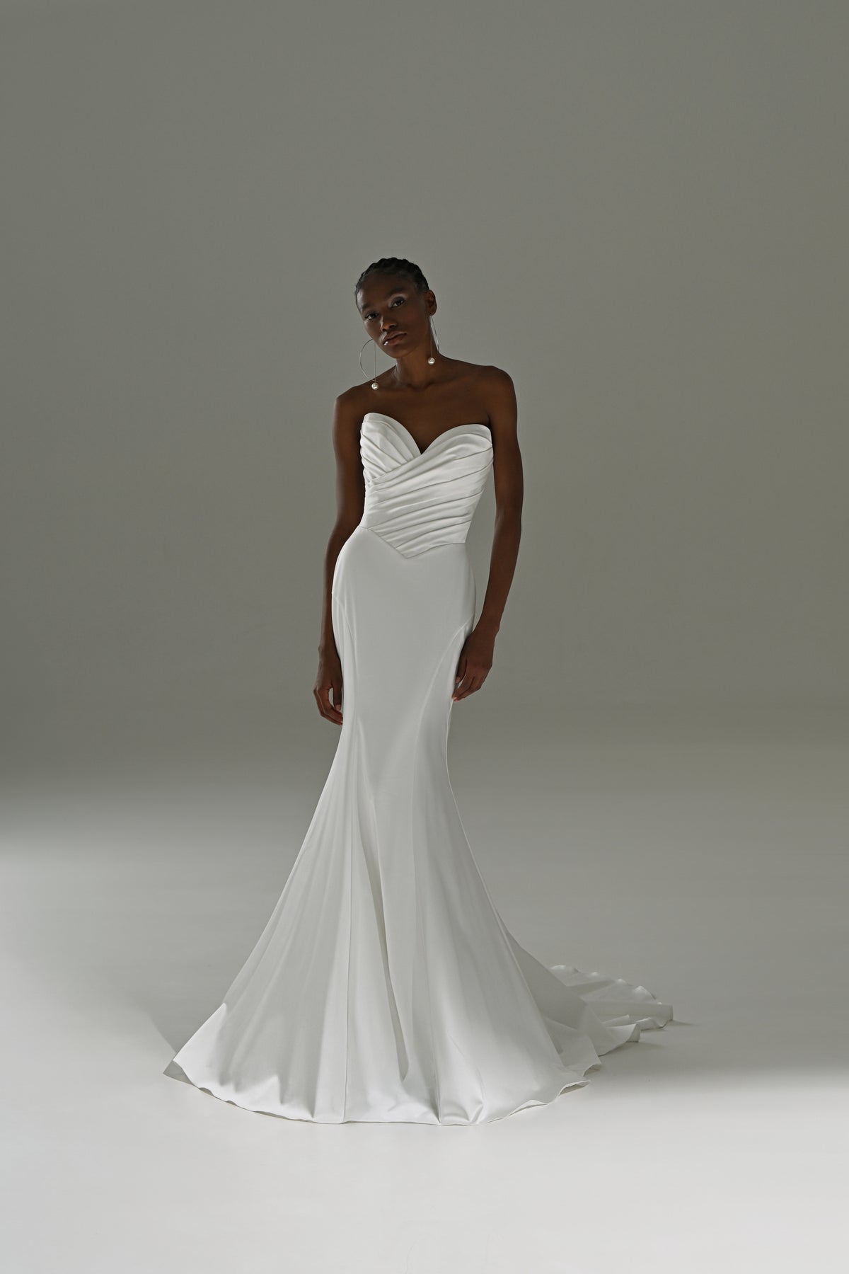 Stretch satin mermaid wedding dress without the overskirt – front view of the sleek mermaid silhouette