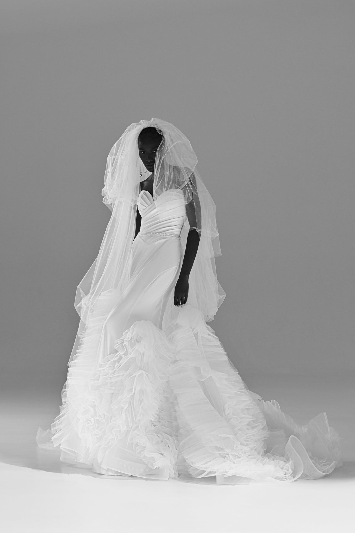 Stretch satin mermaid wedding dress with removable tulle skirt – black and white front view with the veil