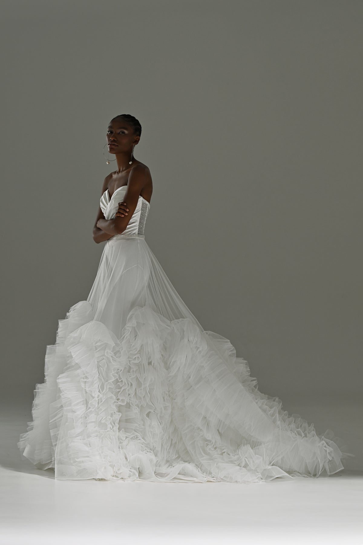 Stretch satin mermaid wedding dress – side view with the ruffled tulle train