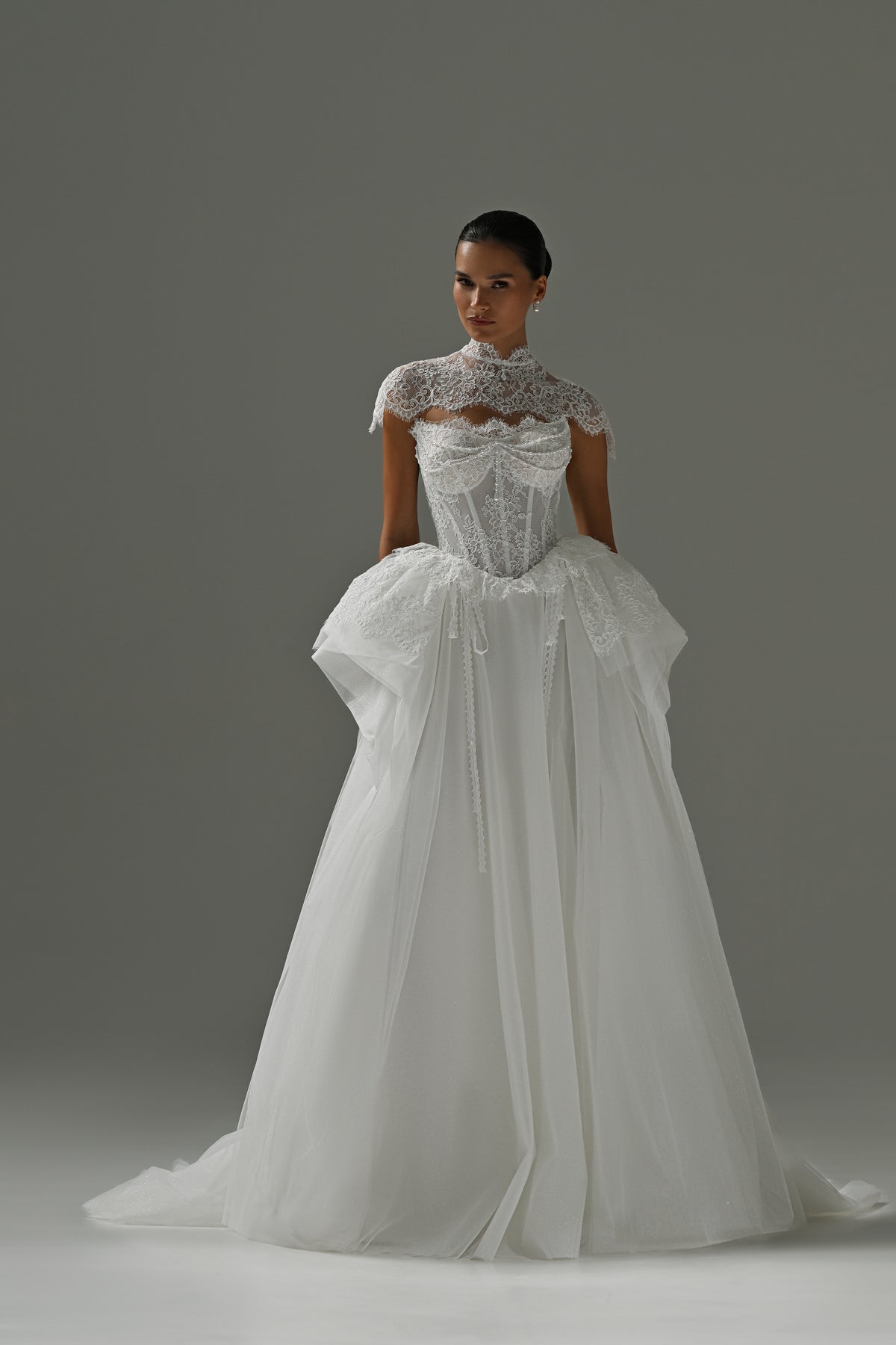 Tulle wedding dress with lace corset bodice and peplum frill – full-length front view