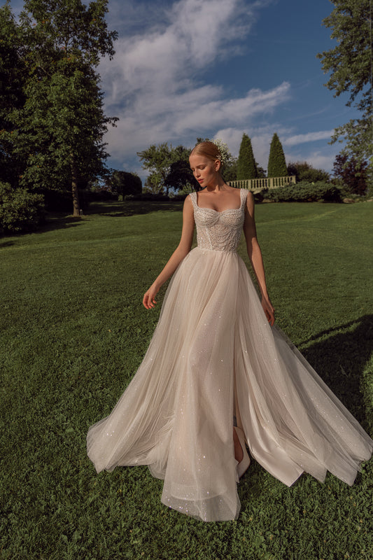 Sleeveless A-line wedding dress with open back & court train