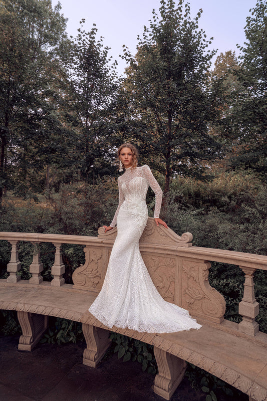 long sleeve lace mermaid wedding dress with high neckline, beaded illusion bodice and floral waist accent