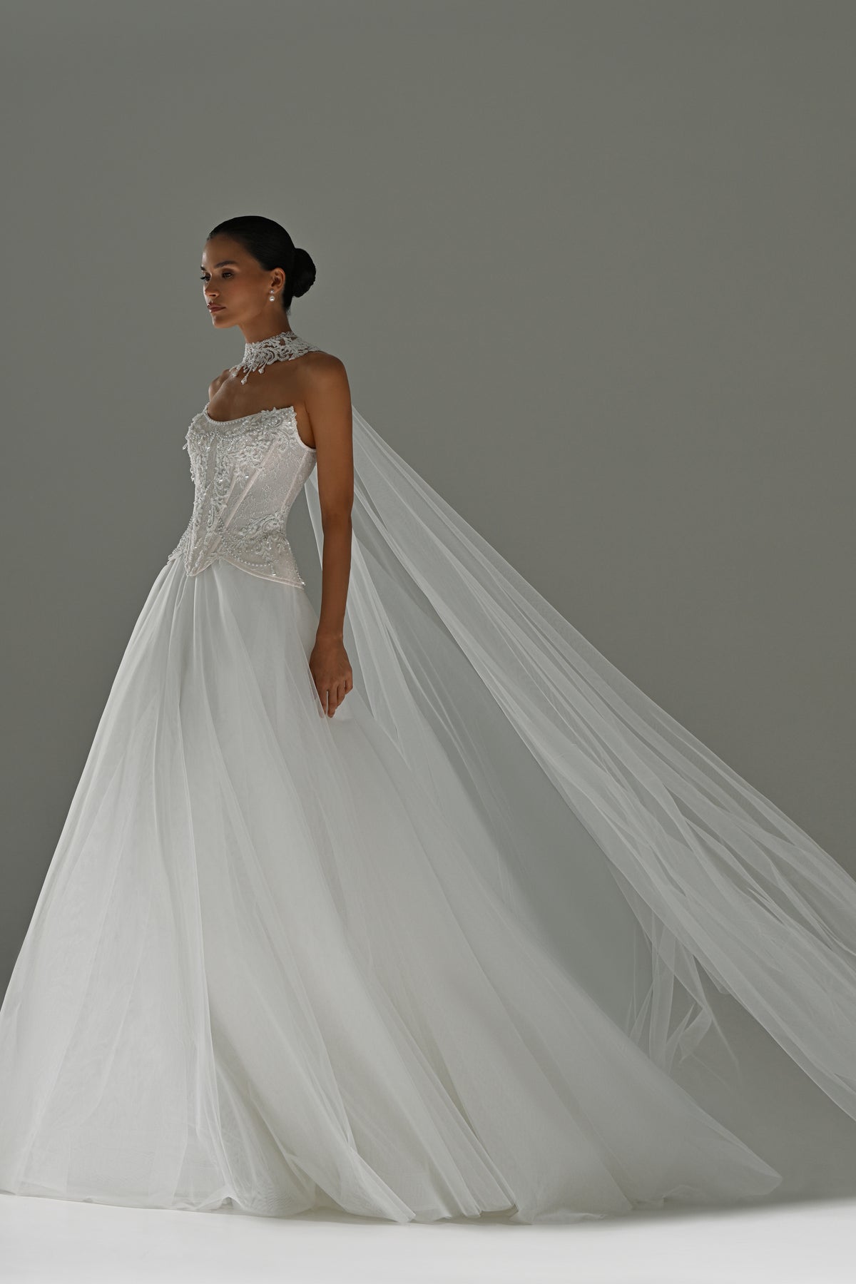 Lace corset wedding dress with removable tulle skirt – side view with the long veil and train