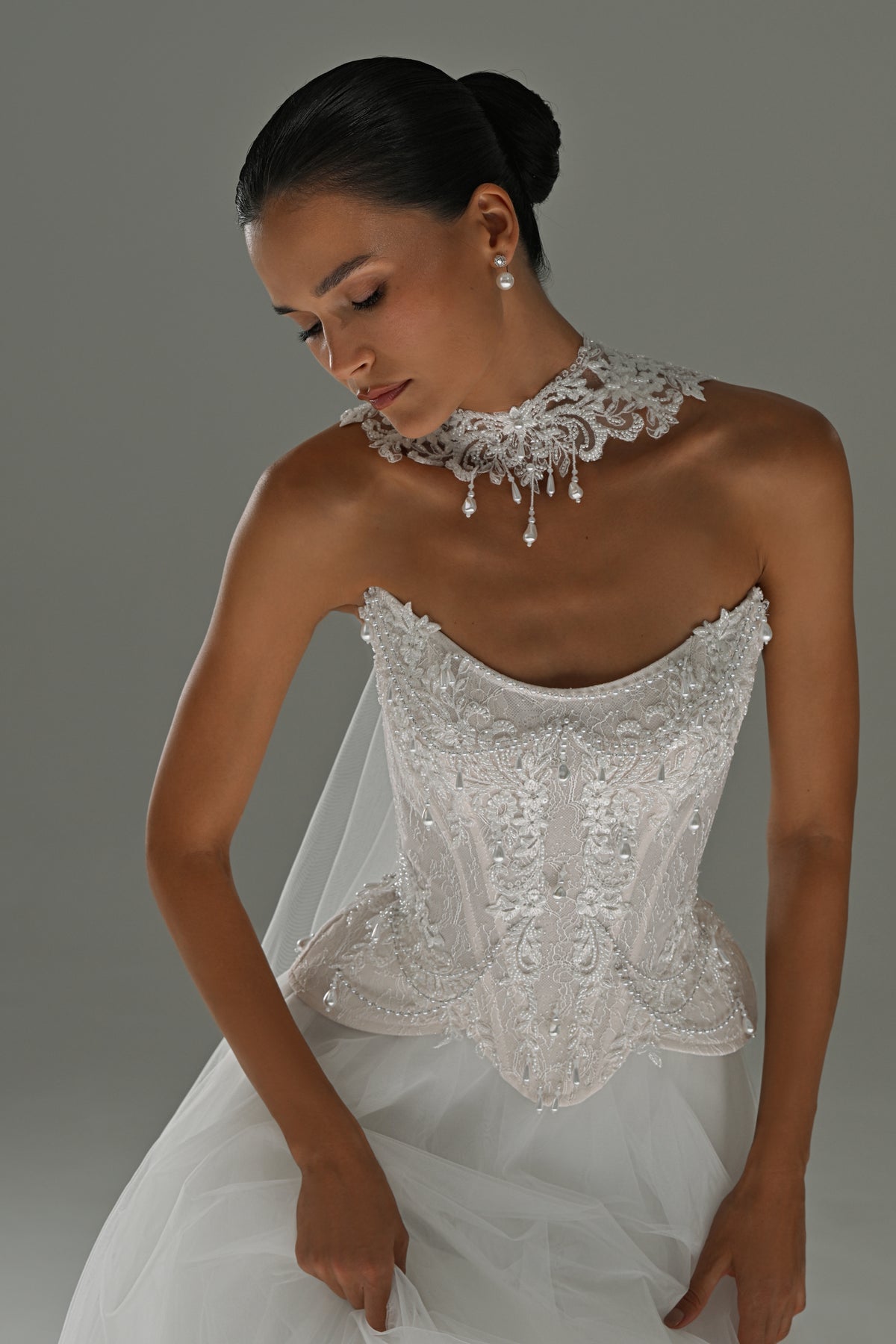 Lace corset wedding dress – close-up of the lace choker collar and corset bodice
