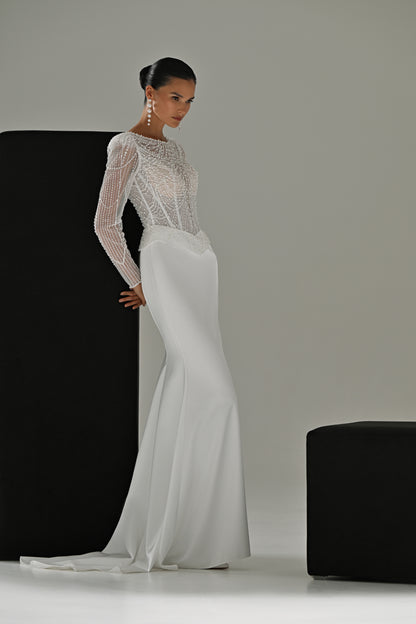 Beaded lace sheath wedding dress with illusion neckline – three-quarter front view