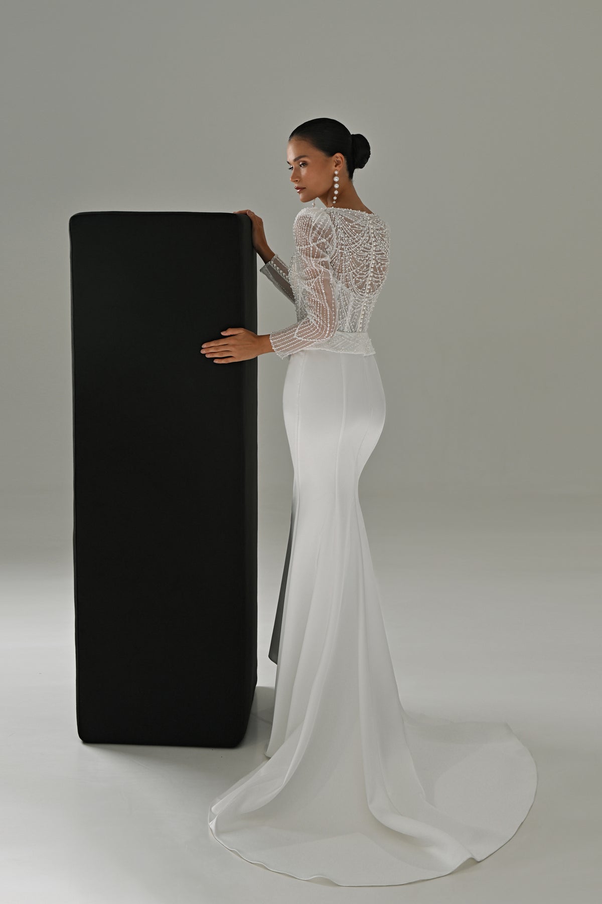 Beaded lace sheath wedding dress – side view with the fitted skirt and small train