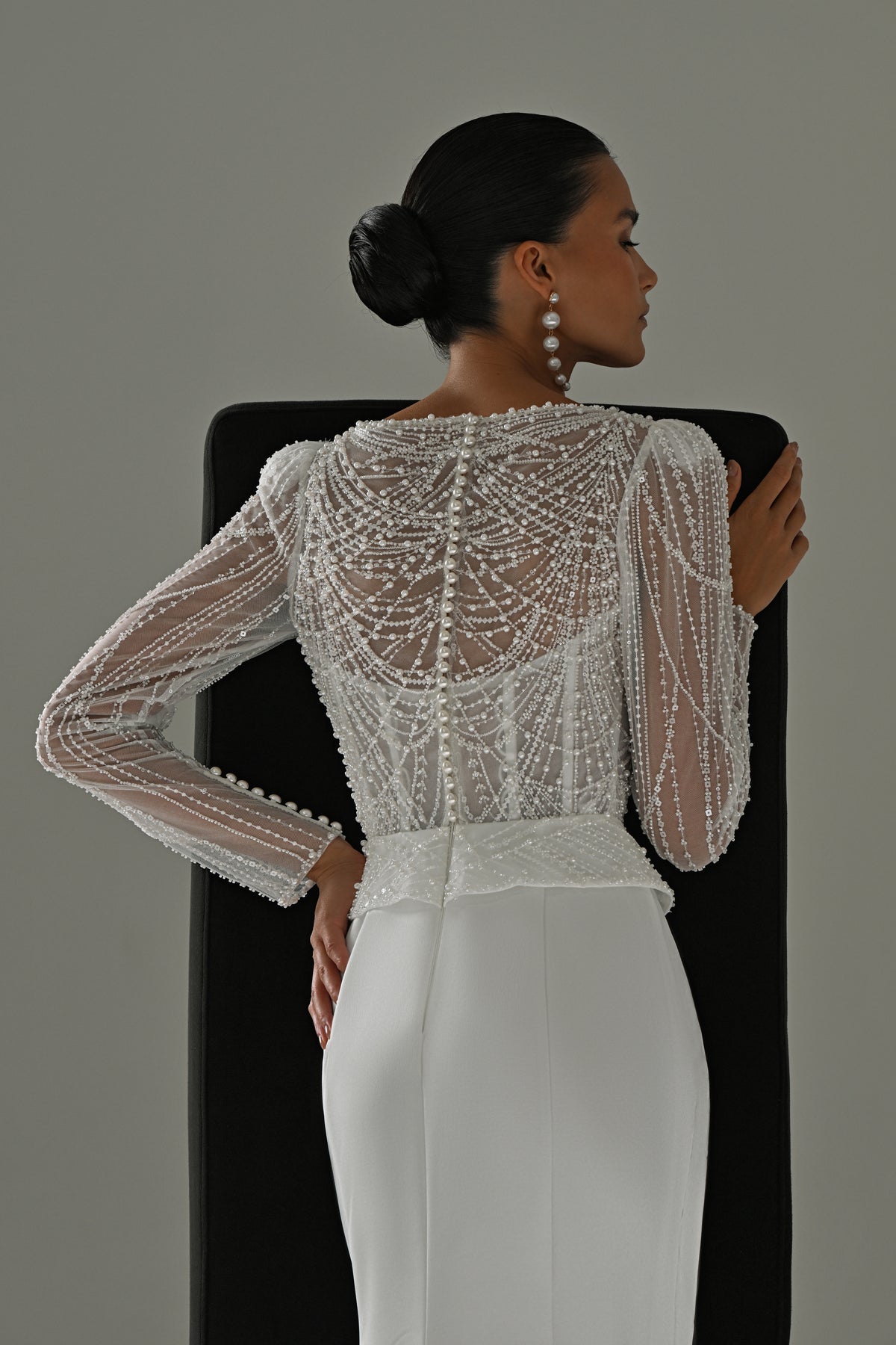 Beaded lace sheath wedding dress – back view of the beaded lace sleeves and sheer lace back