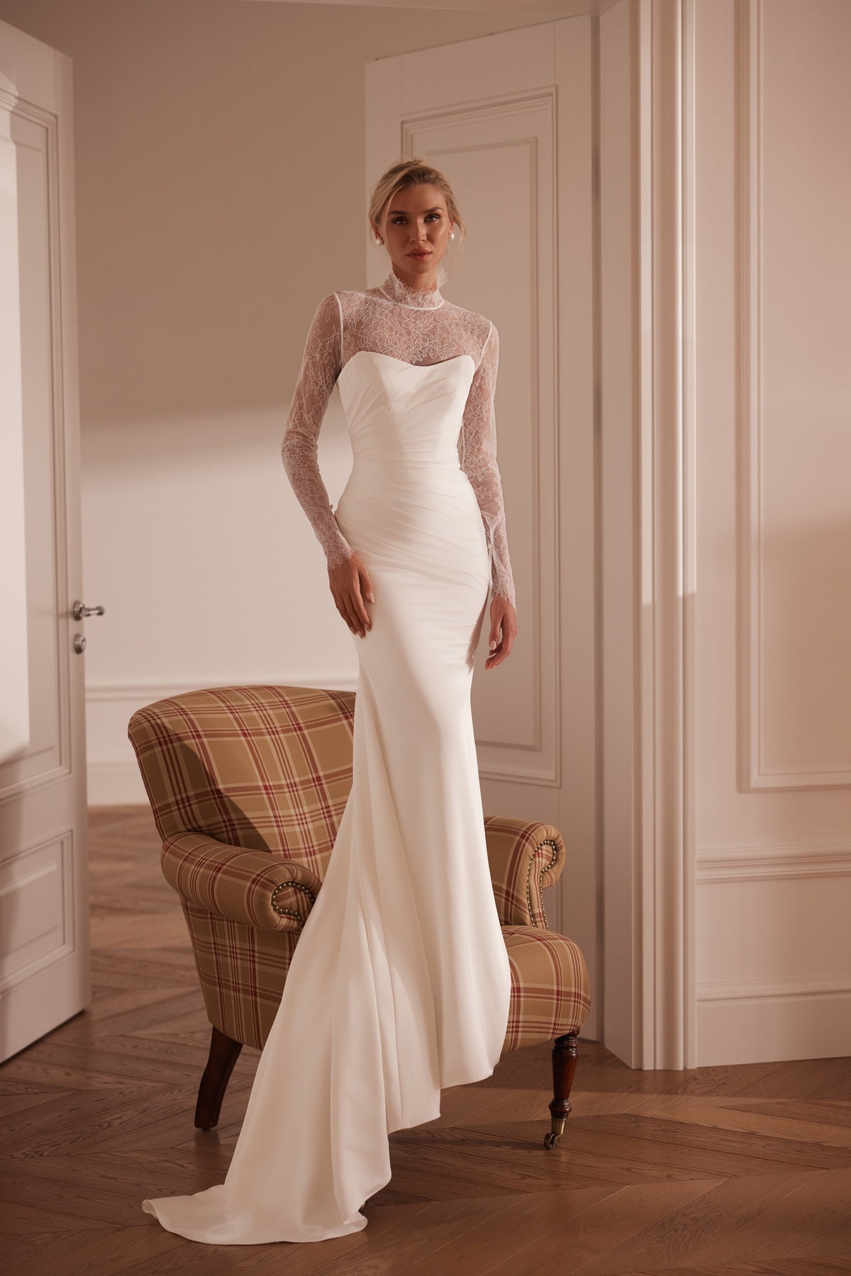 Strapless mermaid crepe wedding dress with ruched bodice and lace bodysuit - front view