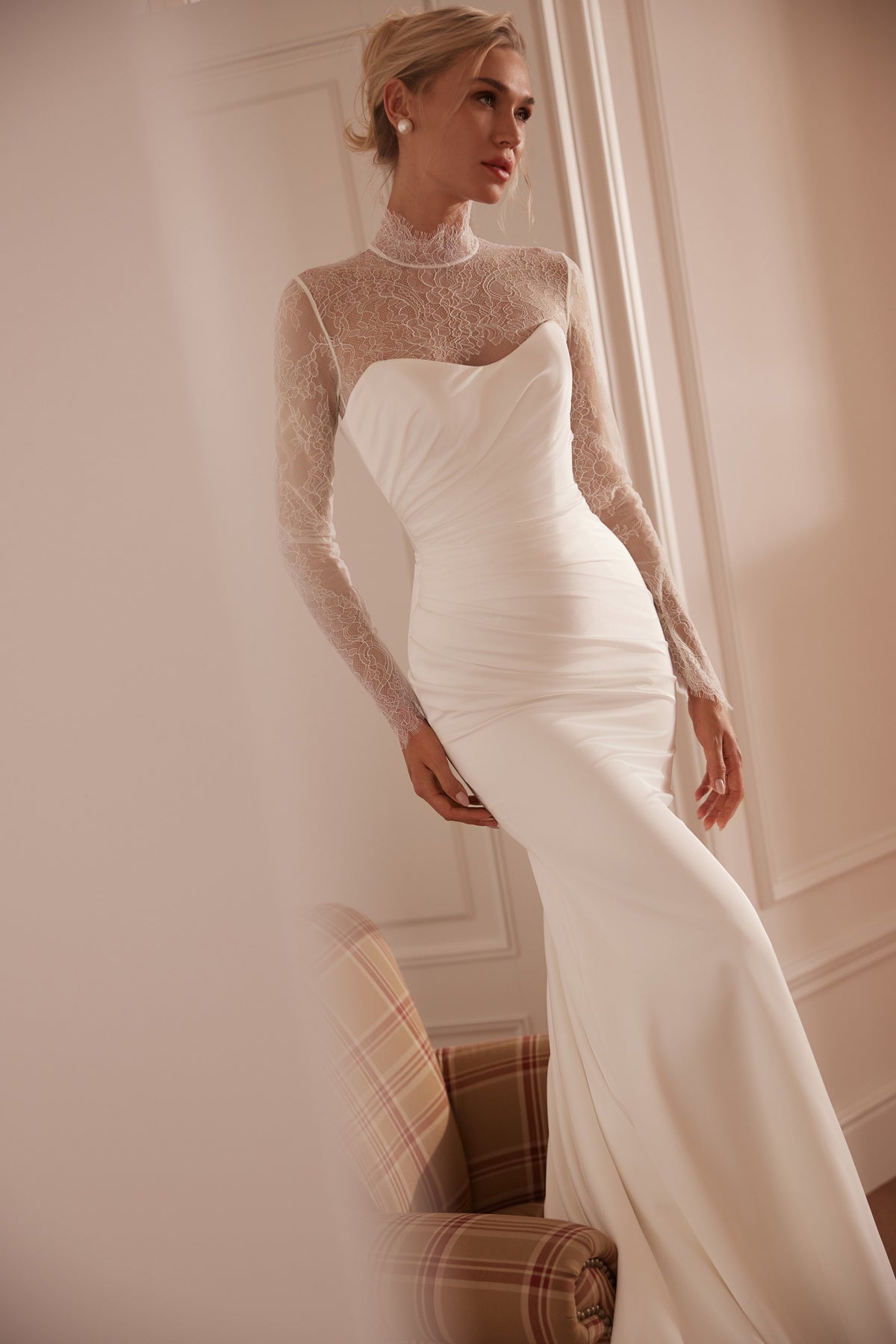 Strapless mermaid crepe wedding dress with ruched bodice and lace bodysuit - side view