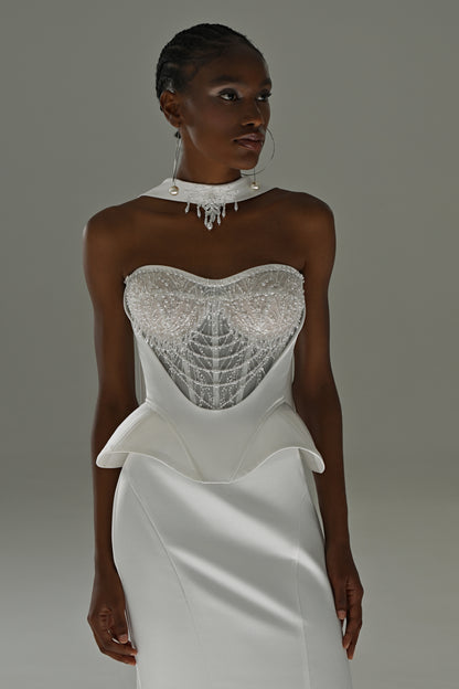 Soft satin mermaid wedding dress – close-up of the lace corset bodice and peplum waist