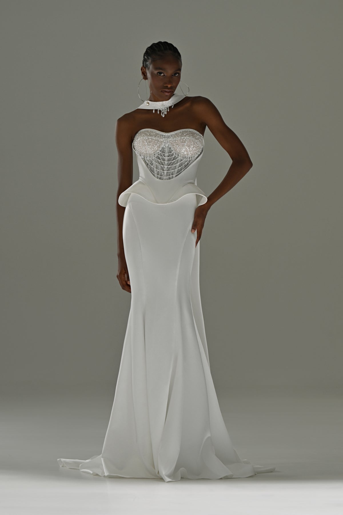 Soft satin mermaid wedding dress with peplum waist – full-length front view, hand on hip